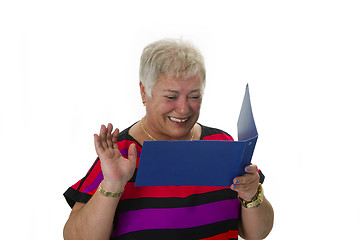 Image showing Female senior looking  at statement of account