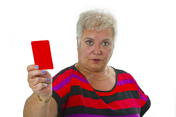 Image showing Female senior shows red card