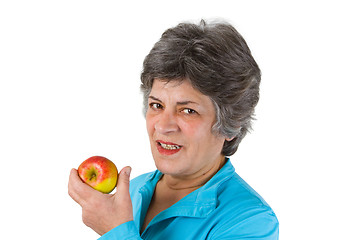 Image showing Senior woman eating apple