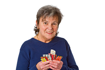 Image showing Female senior with pills