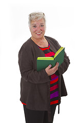 Image showing Female senior reading a book