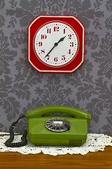 Image showing Old fashioned telephone and clock