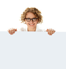 Image showing Female business professional holding blank billboard