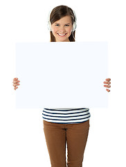 Image showing Musical girl promoting blank banner ad