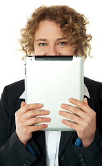 Image showing Corporate lady hiding her face with ipad