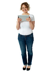 Image showing Charming lady tuned into musical world