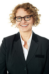 Image showing Cropped image of a curly haired business lady