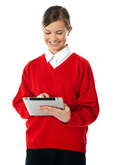 Image showing School girl using new touch pad device