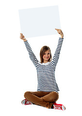 Image showing Gorgeous girl posing with blank white clipboard