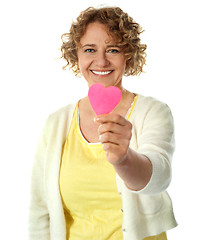 Image showing Happy woman offering her heart