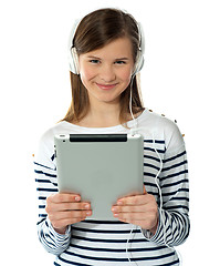 Image showing Smiling pretty girl holding i-pad