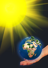 Image showing earth model on a hand