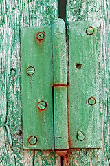 Image showing Old hinges on the wooden boards