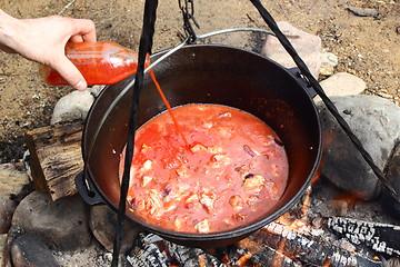 Image showing tomato juice and meat in caldron