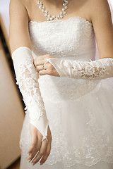 Image showing Pre-ceremony bride dressing