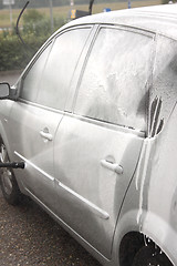 Image showing a car wash with a jet of water and shampoo