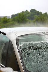 Image showing a car wash with a jet of water and shampoo