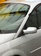 Image showing a car wash with a jet of water and shampoo