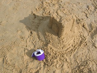 Image showing Abandoned Sand Castle & Watering Can