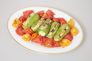 Image showing baked tomatoes and stuffed courgettes