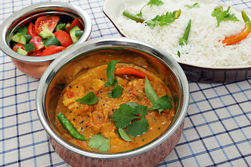 Image showing Serving chicken and tomato curry
