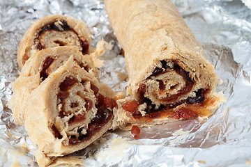 Image showing Spotted dick sliced on tinfoil