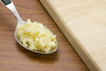 Image showing Spoonful of chopped garlic

