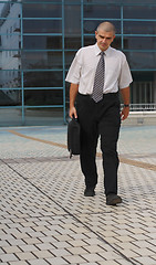 Image showing Businessman walking