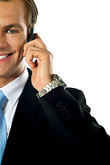 Image showing Cropped image of young businessman talking