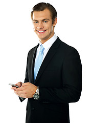 Image showing Corporate man messaging from cellphone