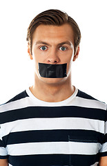 Image showing Man with duct tape over his mouth