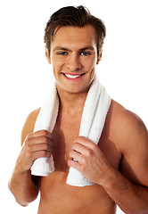 Image showing Portrait of a smiling man with towel around his neck