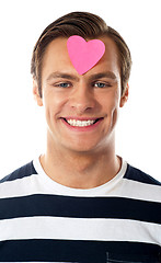 Image showing Closeup of an attractive man with paper heart