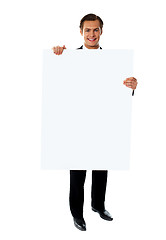 Image showing Business executive promoting big blank banner ad