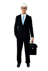 Image showing Portrait of smiling young architect carrying briefcase