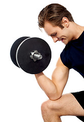 Image showing Portrait of young fit trainer working out