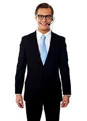 Image showing Male telemarketer posing in headsets, smiling