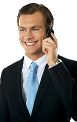 Image showing Businessman communicating via cellphone