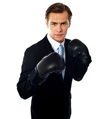 Image showing Handsome businessman posing in boxing gloves
