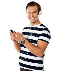 Image showing Handsome man enjoying music