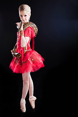 Image showing beautiful ballerina girl in a red scenic dress with  python on black