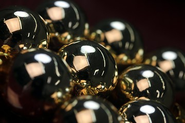 Image showing golden christmas spheres reflection