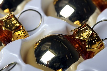 Image showing golden christmas spheres reflection