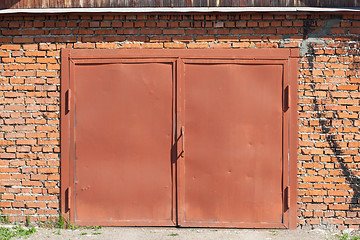 Image showing red metal doors