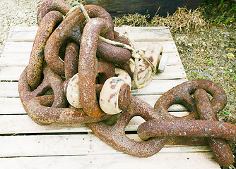 Image showing rusted chains at a boatyard. 