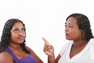 Image showing mother warn her daughter for bad behavior, isolated on white 