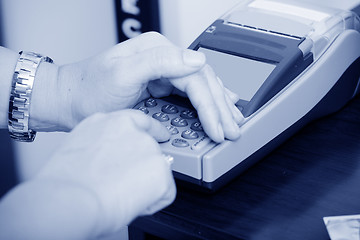 Image showing Human hand enter atm banking cash machine pin code
