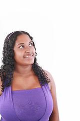 Image showing smiling fat beautiful young woman looking up