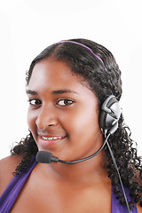 Image showing Smiling black customer service and support woman wearing headset