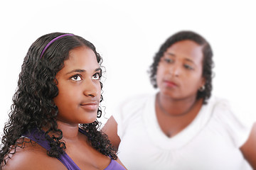 Image showing teenage girl with unhappy mother in the background